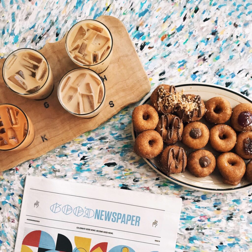 Picture of doughnuts and coffee on a colorful counter from Dough Bakery in Bed-Stuy, Brooklyn near the Refuge at 1 Halsey