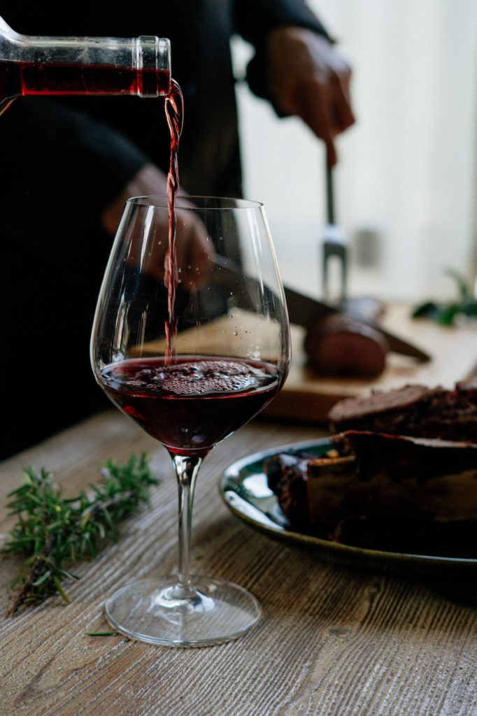 Glass of red wine being poured at Speakvino in Bedford-Stuyvesant near the Refuge Brooklyn