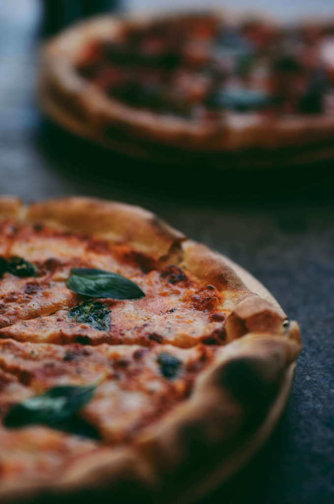 Close-up of a pizza from Saraghina Pizza in Bedford-Stuyvesant near The Refuge Brooklyn
